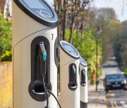 a row of electric car chargers on a UK street