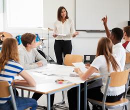teacher teaching a classroom of kids