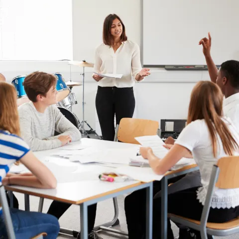 teacher teaching a classroom of kids