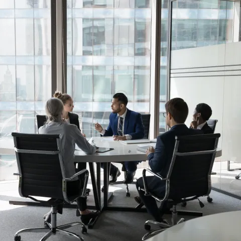 A team of professionals having a meeting in a modern boardroom