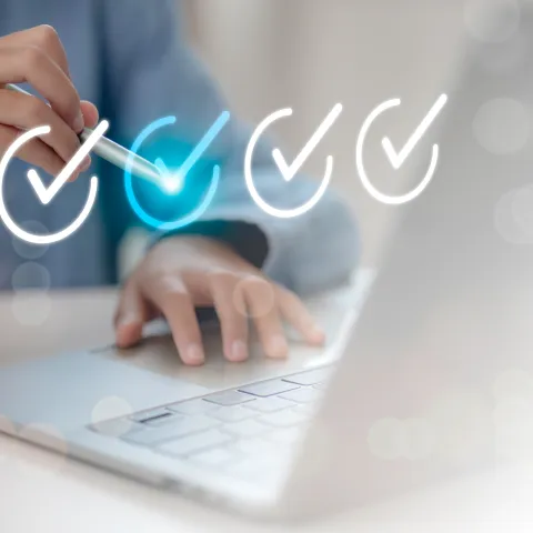 Business person tick marks an assessment, questionnaire