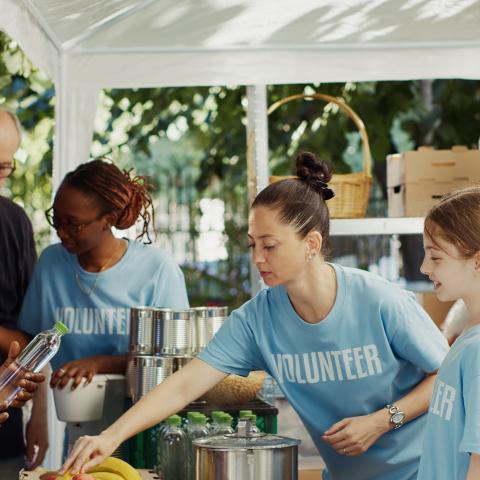 photo of food bank volunteers handing out meals