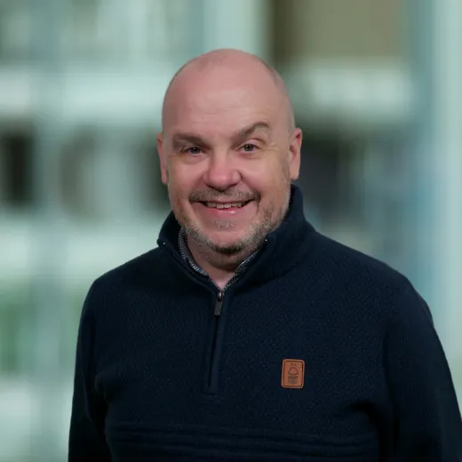 headshot of Ian Dickinson