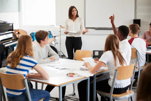 teacher teaching a classroom of kids